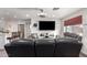Comfortable living room featuring a modern ceiling fan, and a view into the updated kitchen at 4113 N 10Th Pl, Phoenix, AZ 85014