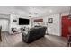 Bright living room with wood flooring, a red door accent, and plenty of natural light at 4113 N 10Th Pl, Phoenix, AZ 85014