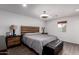 Comfortable main bedroom with modern lighting, wood-look floors, and large padded bench at 4113 N 10Th Pl, Phoenix, AZ 85014