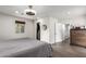 Comfortable main bedroom with modern lighting, wood-look floors, walk in closet and neutral color scheme at 4113 N 10Th Pl, Phoenix, AZ 85014