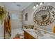 Neutral bathroom with decorative lighting and vanity, and shower over tub at 4432 E Carmel Ave, Mesa, AZ 85206