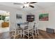 Bright dining area featuring a modern table and chairs, hardwood floors, and stylish decor at 4432 E Carmel Ave, Mesa, AZ 85206