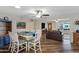 Inviting dining and living area with hardwood floors, modern furniture, and an open layout for entertaining at 4432 E Carmel Ave, Mesa, AZ 85206