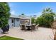A backyard patio with outdoor furniture and mature landscaping at 4432 E Carmel Ave, Mesa, AZ 85206