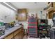 Organized workshop area with ample shelving and workspace, plus tool storage at 4432 E Carmel Ave, Mesa, AZ 85206