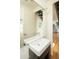 Modern bathroom features a sleek vanity with stylish sink and view into the hallway at 4507 N 12Th St # 6, Phoenix, AZ 85014