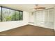 Bright, minimalist bedroom with a large window, built-in closet and warm, neutral color palette at 4507 N 12Th St # 6, Phoenix, AZ 85014