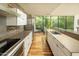 Modern kitchen with clean lines, stainless steel appliances and bright natural light and an adjacent dining space at 4507 N 12Th St # 6, Phoenix, AZ 85014