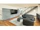 Stylish living room features hardwood floors, modern furnishings and a view of the staircase at 4507 N 12Th St # 6, Phoenix, AZ 85014