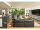 Bright living room featuring hardwood floors, large windows and modern furnishings with a view to the kitchen at 4507 N 12Th St # 6, Phoenix, AZ 85014