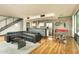 Open concept living room with modern decor, hardwood floors, and kitchen and dining area at 4507 N 12Th St # 6, Phoenix, AZ 85014