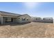 Expansive dirt backyard presenting an opportunity for outdoor customization and enjoyment at 4946 W Weeping Willow Way, Laveen, AZ 85339