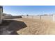 Large dirt backyard awaiting landscaping, offering a blank canvas at 4946 W Weeping Willow Way, Laveen, AZ 85339