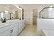 Modern bathroom featuring double sinks, a walk-in shower, and sleek fixtures at 4946 W Weeping Willow Way, Laveen, AZ 85339