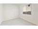 Bright bedroom with a window and neutral carpet, ready for personalization at 4946 W Weeping Willow Way, Laveen, AZ 85339