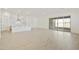 Bright open-concept living space with access to a modern kitchen and a sliding glass door to the backyard at 4946 W Weeping Willow Way, Laveen, AZ 85339