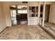 View of an empty living room showing an open floor plan leading to a kitchen at 5220 E Winchcomb Dr, Scottsdale, AZ 85254