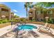 Community hot tub area with lounge chairs and landscaping at 5335 E Shea Blvd # 2047, Scottsdale, AZ 85254