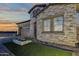 Beautiful single-Gathering home showing stone detail and a well manicured lawn at 5748 E Sierra Morena St, Mesa, AZ 85215
