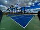 Bright blue pickleball courts ready for play under partly cloudy skies at 5748 E Sierra Morena St, Mesa, AZ 85215