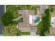 Aerial view showcases backyard with pool, green space and unique paved design at 5801 E Exeter Blvd, Phoenix, AZ 85018