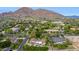 Gorgeous aerial shot of neighborhood with tree-lined streets and view of mountain range at 5801 E Exeter Blvd, Phoenix, AZ 85018
