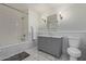 Elegant bathroom showcasing marble floors and a gray vanity with marble countertop at 5801 E Exeter Blvd, Phoenix, AZ 85018