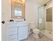 Bright bathroom with a glass-enclosed shower, stylish mirror, and a modern sink at 5801 E Exeter Blvd, Phoenix, AZ 85018