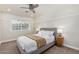 Cozy bedroom with a neutral color scheme, plush carpet, and natural light from the window at 5801 E Exeter Blvd, Phoenix, AZ 85018