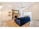 Stylish living room featuring a stone fireplace, built-in shelving, and a comfortable blue sectional at 5801 E Exeter Blvd, Phoenix, AZ 85018