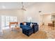 Bright living room with vaulted ceiling, cozy seating, and a seamless flow to the outdoor space at 5801 E Exeter Blvd, Phoenix, AZ 85018