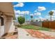 Spacious backyard with brick patio, lawn, and mature trees offers tranquil retreat at 6235 N 25Th Ave, Phoenix, AZ 85015