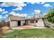 Spacious backyard featuring a detached garage, brick patio, and well-kept lawn perfect for outdoor entertaining at 6235 N 25Th Ave, Phoenix, AZ 85015