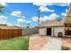 Well-maintained backyard with brick patio, lawn, and detached garage providing great outdoor living at 6235 N 25Th Ave, Phoenix, AZ 85015