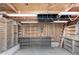 Unfinished basement with wood storage shelves and ladder at 6235 N 25Th Ave, Phoenix, AZ 85015