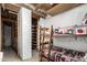 Basement rec room with bunk beds and storage shelves at 6235 N 25Th Ave, Phoenix, AZ 85015