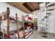 Finished basement with bunkbeds and a spiral staircase at 6235 N 25Th Ave, Phoenix, AZ 85015