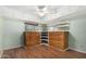 This large bedroom has wood floors, many drawers, storage, and dual windows at 6235 N 25Th Ave, Phoenix, AZ 85015