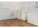 Bedroom with bright white walls, fan and hardwood flooring with ensuite bathroom at 6235 N 25Th Ave, Phoenix, AZ 85015