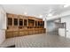 Spacious living room featuring built-in wooden cabinetry and light tile flooring throughout at 6235 N 25Th Ave, Phoenix, AZ 85015