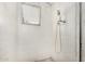 A shower room with white painted brick walls, one window, and modern shower fixtures at 6235 N 25Th Ave, Phoenix, AZ 85015