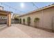 Expansive backyard with paver flooring, string lights, and decorative climbing plants at 6853 E Posada Cir, Mesa, AZ 85212