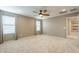 Spacious bedroom with neutral walls, carpet floors, a ceiling fan, and natural light at 6853 E Posada Cir, Mesa, AZ 85212