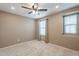 Comfortable bedroom with neutral carpet, recessed lighting, a ceiling fan, and a bright window at 6853 E Posada Cir, Mesa, AZ 85212