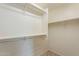 Walk-in closet featuring white shelving, providing ample storage space at 6853 E Posada Cir, Mesa, AZ 85212