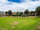 Expansive community green space with playground, pool and ramada for residents to enjoy at 6853 E Posada Cir, Mesa, AZ 85212