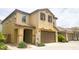 Charming two-story home with a tile roof, two-car garage and covered entry way at 6853 E Posada Cir, Mesa, AZ 85212