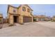 Lovely two-story home with a brown garage door and well-kept landscaping at 6853 E Posada Cir, Mesa, AZ 85212