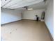Spacious and clean two car garage features sealed flooring and ample space for vehicles at 6853 E Posada Cir, Mesa, AZ 85212