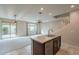 Bright living area and kitchen with stainless appliances and seamless access to the staircase at 6853 E Posada Cir, Mesa, AZ 85212
